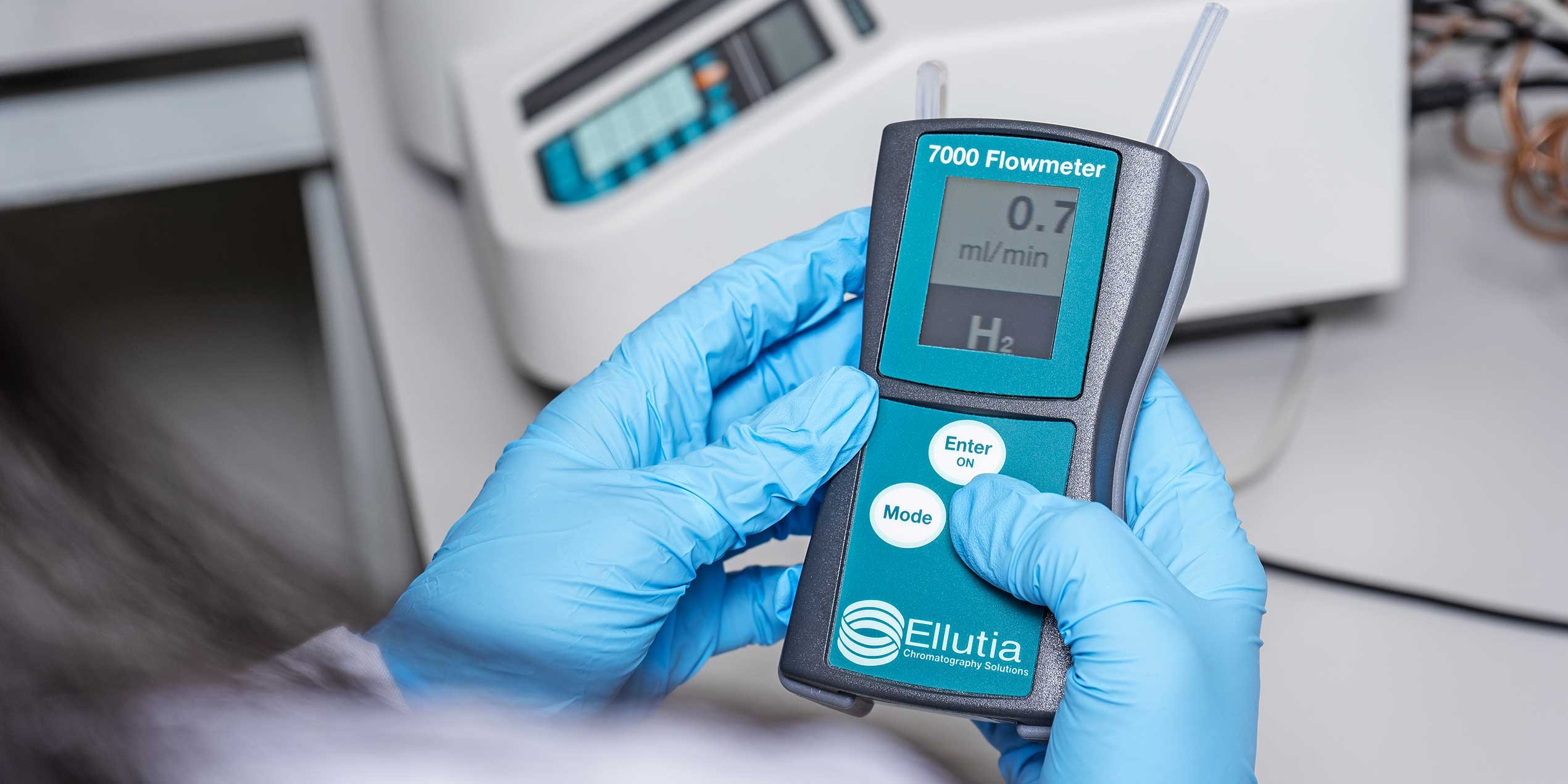 Scientist measuring flow using Ellutia Flowmeter with Gas Chromatograph-11