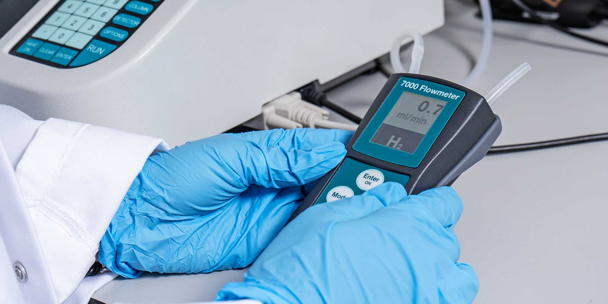 Scientist measuring flow using Ellutia Flowmeter with Gas Chromatograph-27